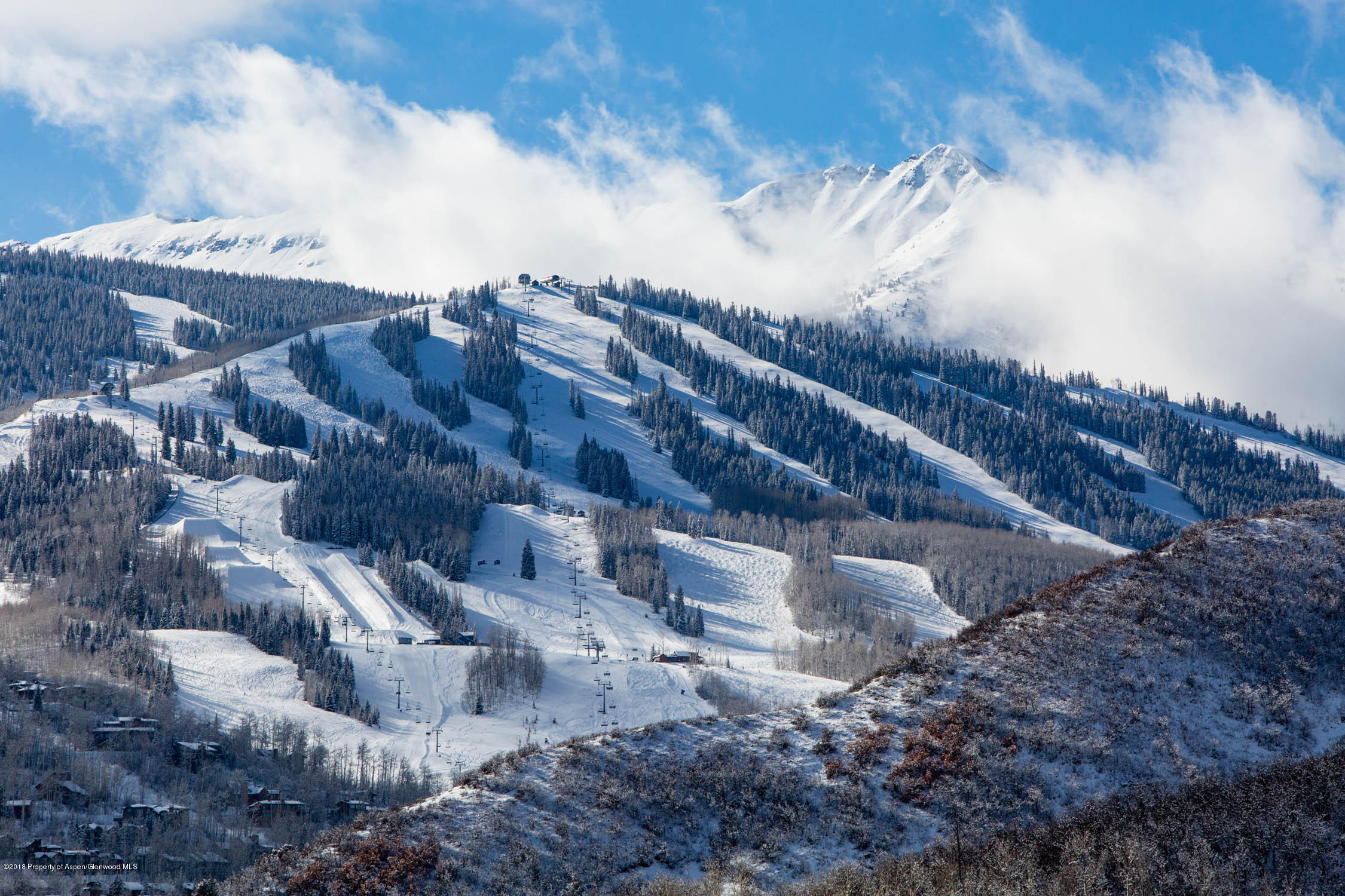 61 Oak Ridge Road Snowmass Village, CO 81615 - Photo 7 of 35 a view of a large building with a yard