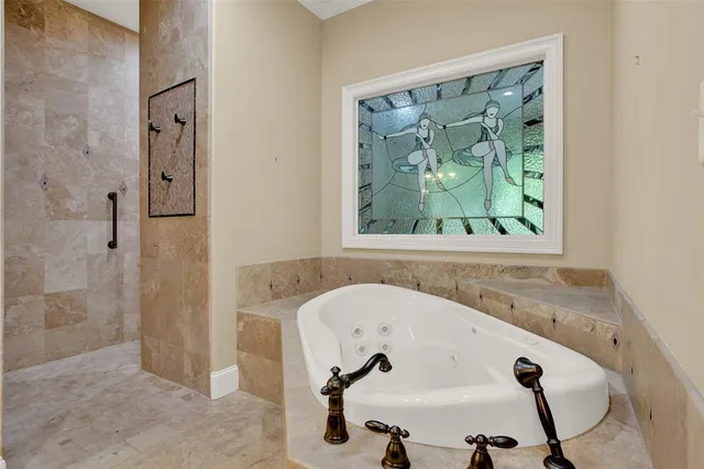 a bathroom with a tub and a window