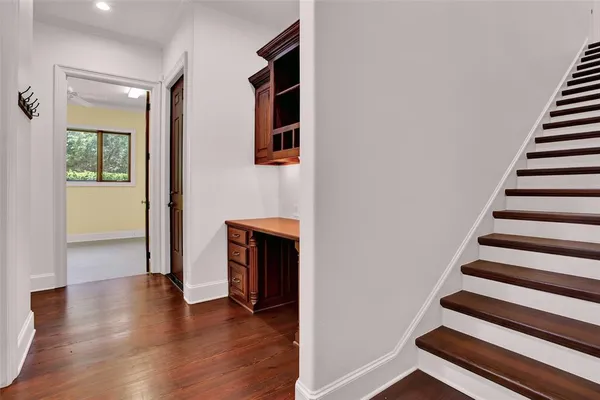 wooden floor in an empty room with a fireplace