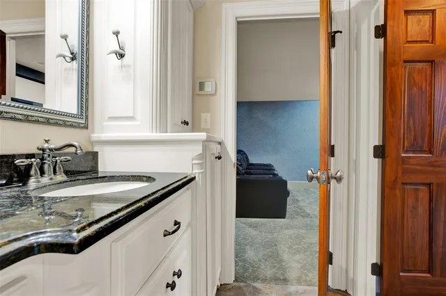 a kitchen with a sink and a refrigerator