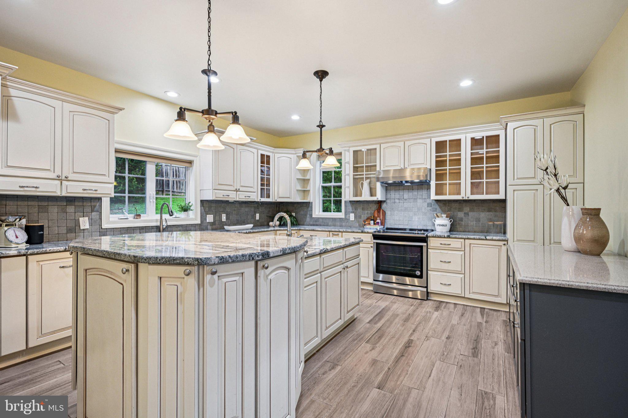 700 South Roberts Road Bryn Mawr, PA 19010 - Photo 13 of 42 a kitchen with stainless steel appliances granite countertop a stove and cabinets
