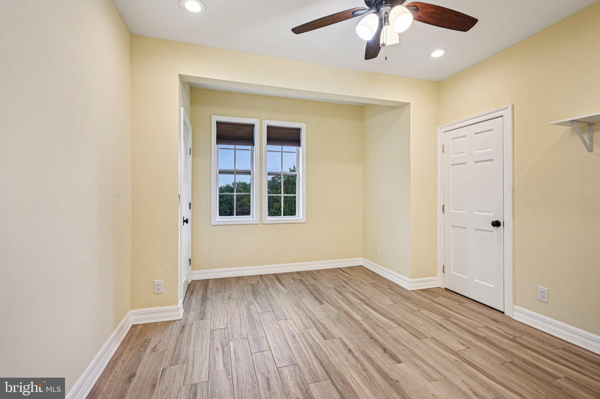 700 South Roberts Road Bryn Mawr, PA 19010 - Photo 19 of 42 a view of an empty room with wooden floor and a window
