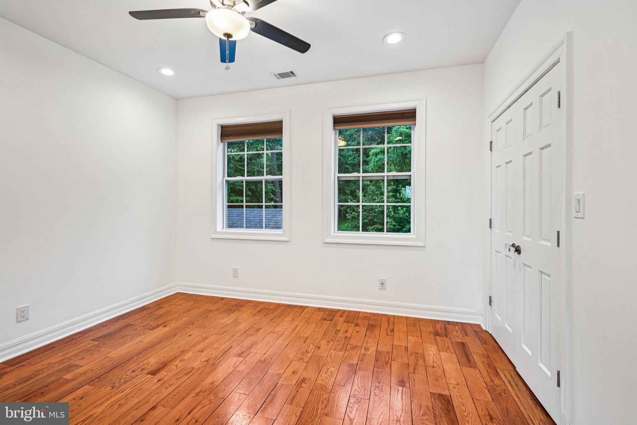 700 South Roberts Road Bryn Mawr, PA 19010 - Photo 20 of 42 a view of an empty room with wooden floor and a window