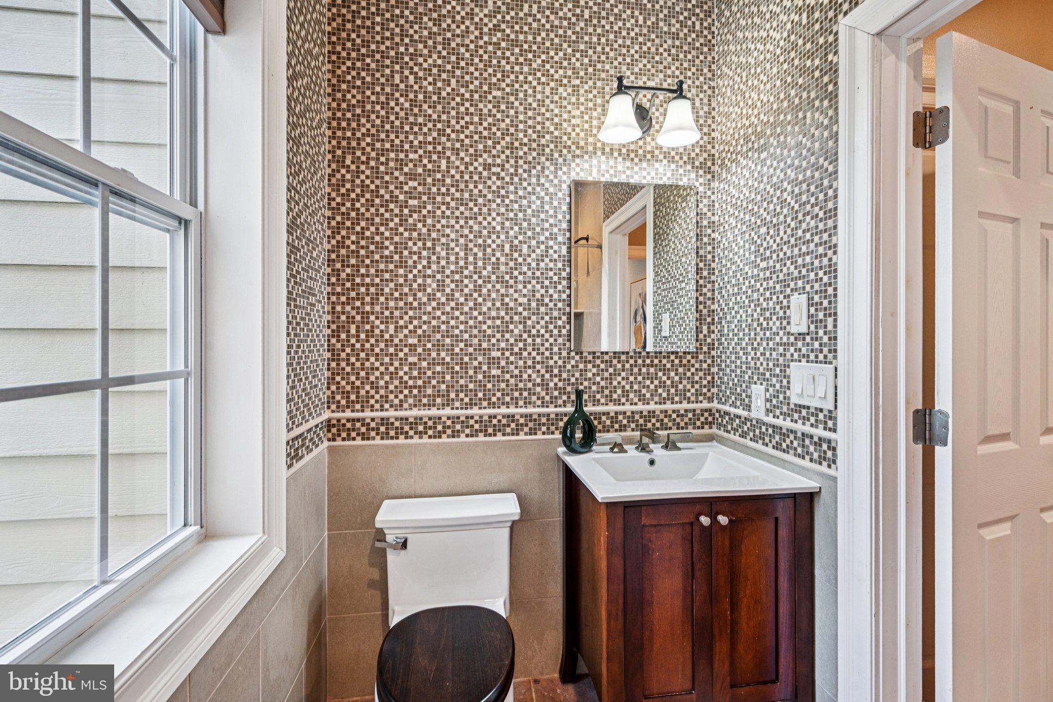 700 South Roberts Road Bryn Mawr, PA 19010 - Photo 21 of 42 a bathroom with a sink a mirror and a toilet