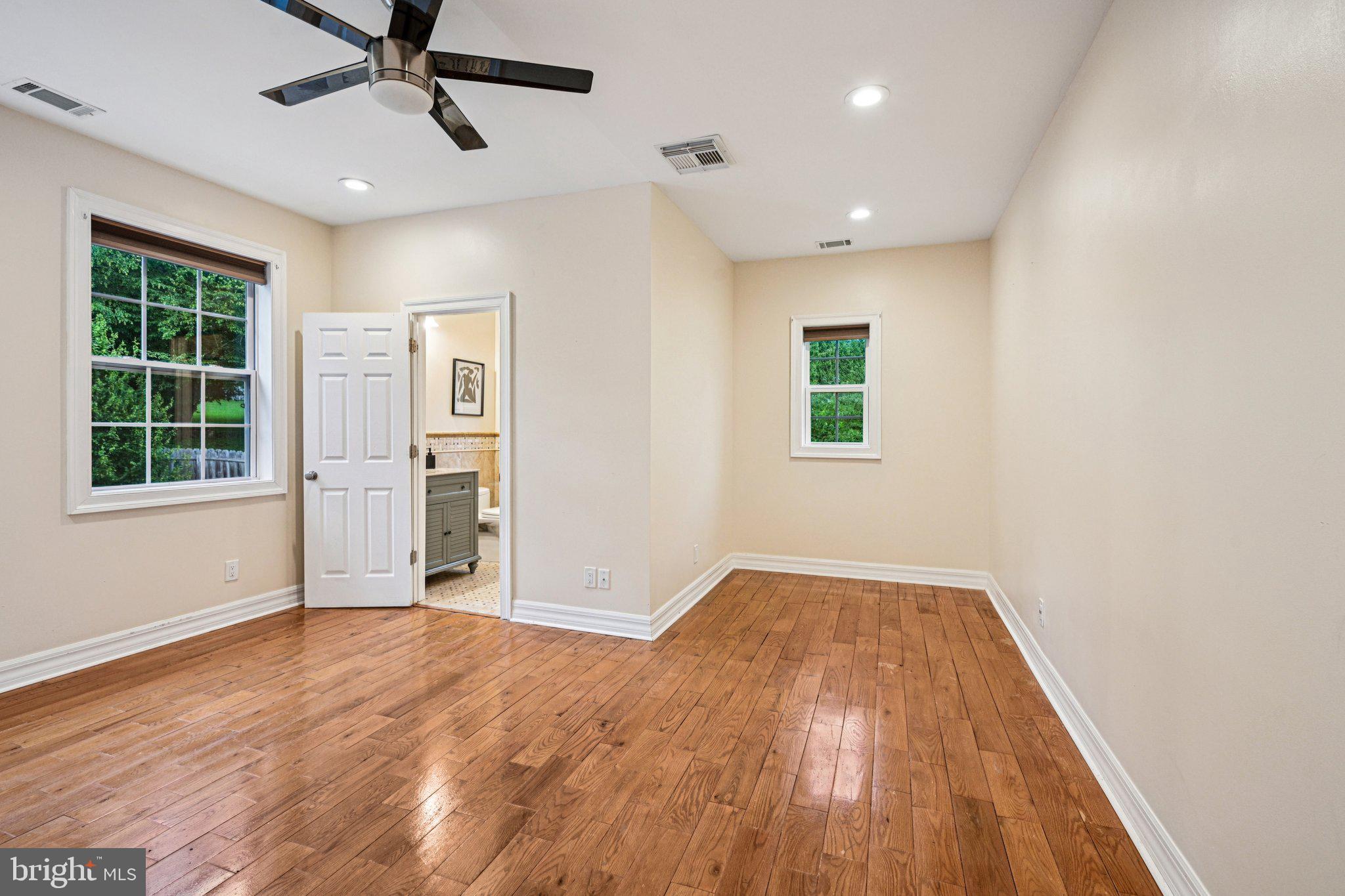 700 South Roberts Road Bryn Mawr, PA 19010 - Photo 24 of 42 a view of a big room with wooden floor windows and ceiling fan