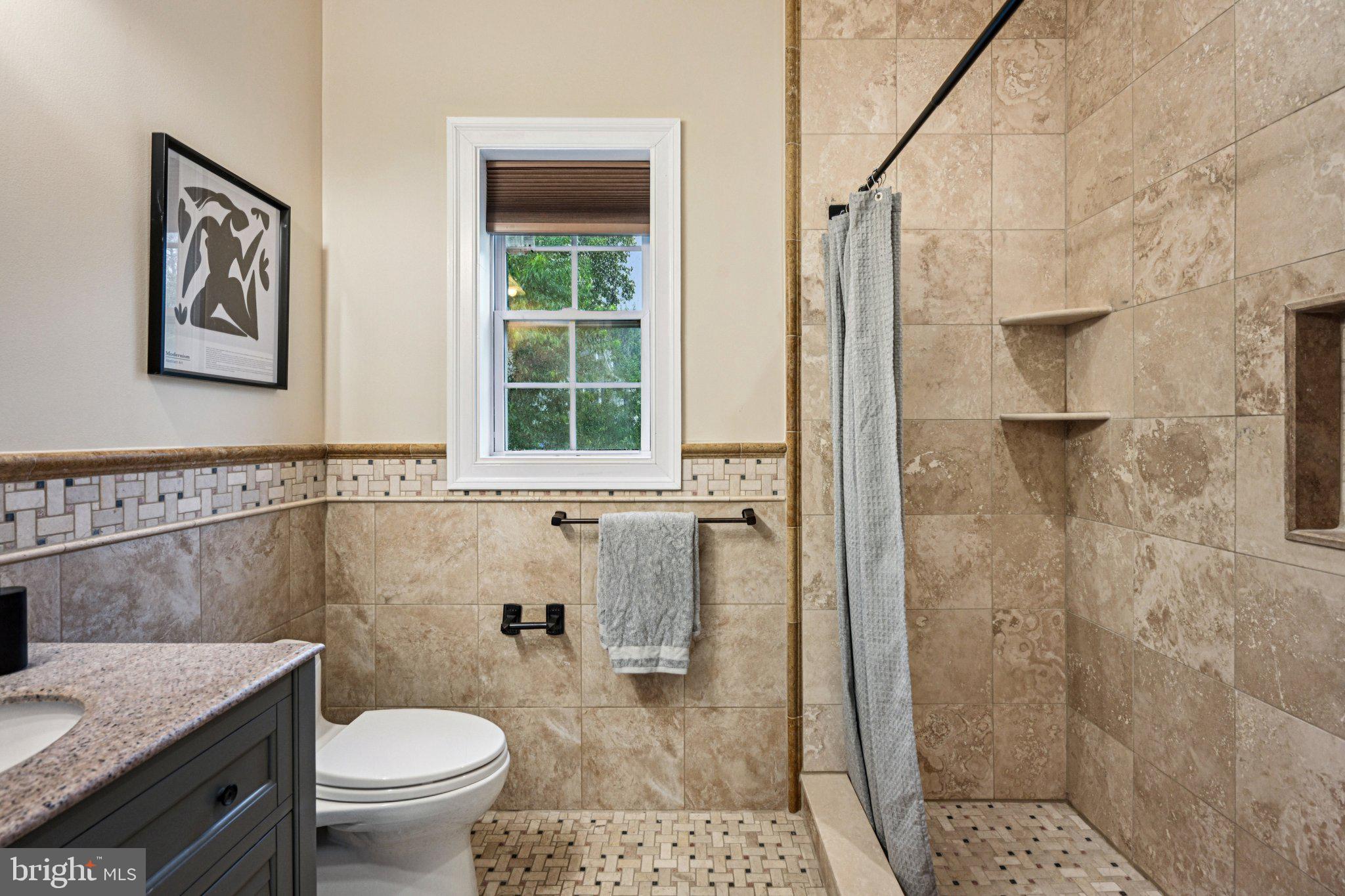 700 South Roberts Road Bryn Mawr, PA 19010 - Photo 25 of 42 a bathroom with a granite countertop sink a toilet and shower