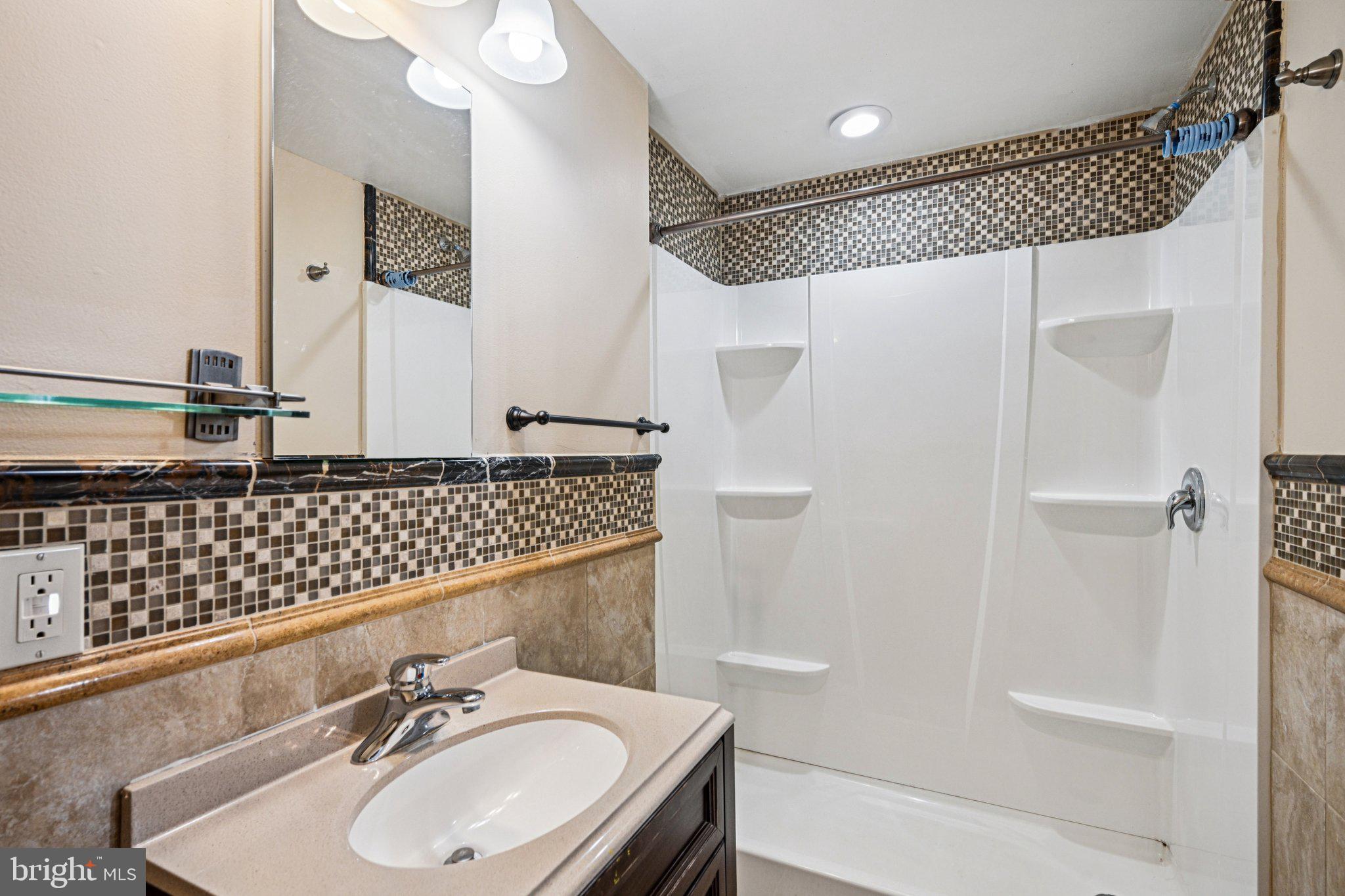 700 South Roberts Road Bryn Mawr, PA 19010 - Photo 28 of 42 a bathroom with a sink and a mirror