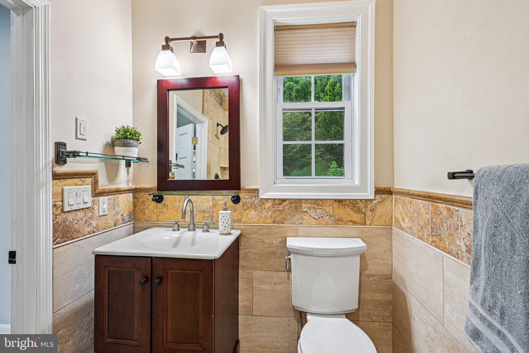 700 South Roberts Road Bryn Mawr, PA 19010 - Photo 7 of 42 a bathroom with a sink a toilet and mirror