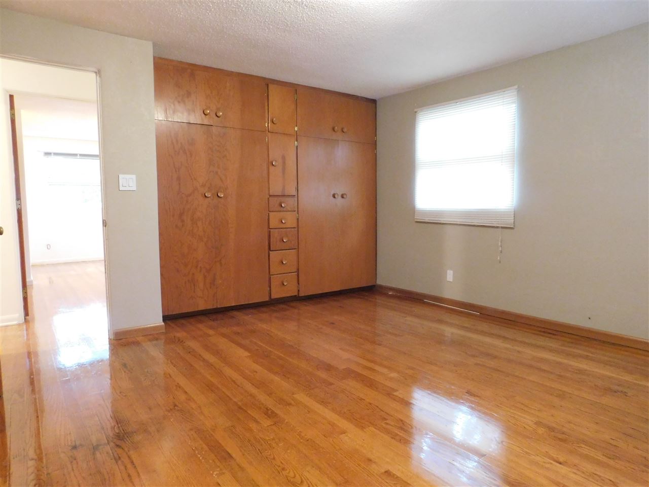 6309 Park Ridge Road Loves Park, IL 61111 - Photo 15 of 26 a view of an empty room with wooden floor and a window