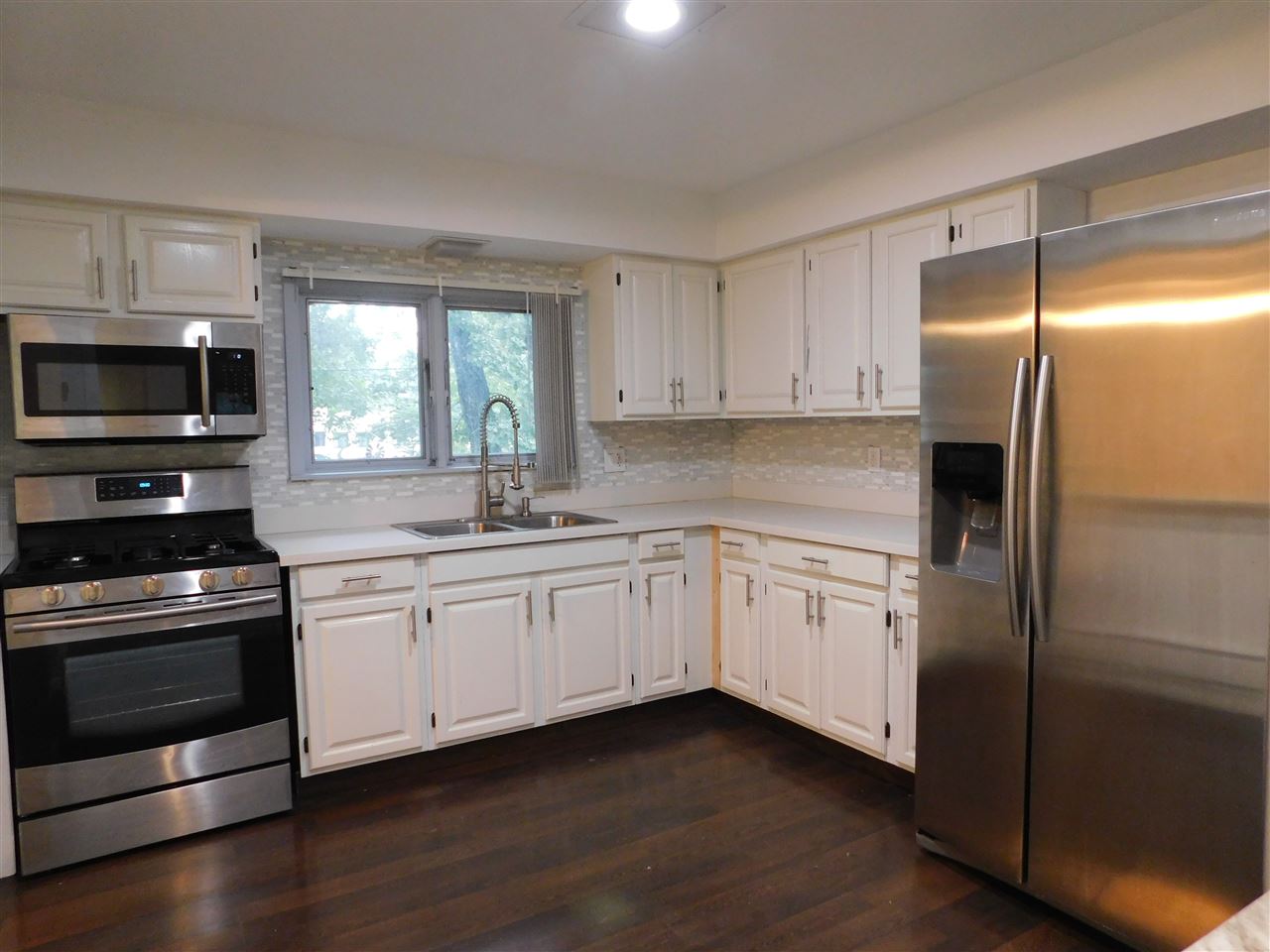 6309 Park Ridge Road Loves Park, IL 61111 - Photo 5 of 26 a kitchen with granite countertop a refrigerator stove and sink
