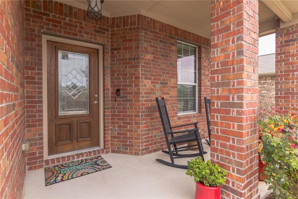 252 Pond View Pass Buda, TX 78610 - Photo 2 of 37 Entrance to property featuring brick siding and covered porch