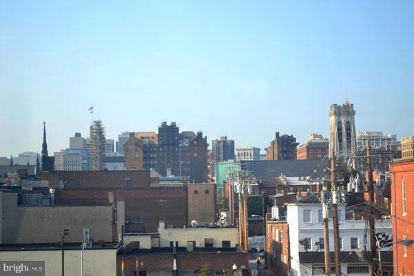 1018 North Charles Street, Unit R7 Baltimore, MD 21201 - Photo 12 of 13 a view of a city with tall buildings