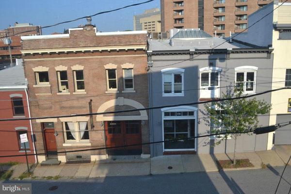 1018 North Charles Street, Unit R7 Baltimore, MD 21201 - Photo 13 of 13 a large building with a lot of windows