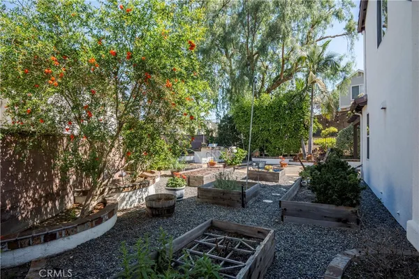 a view of a patio with table and chairs and potted plants