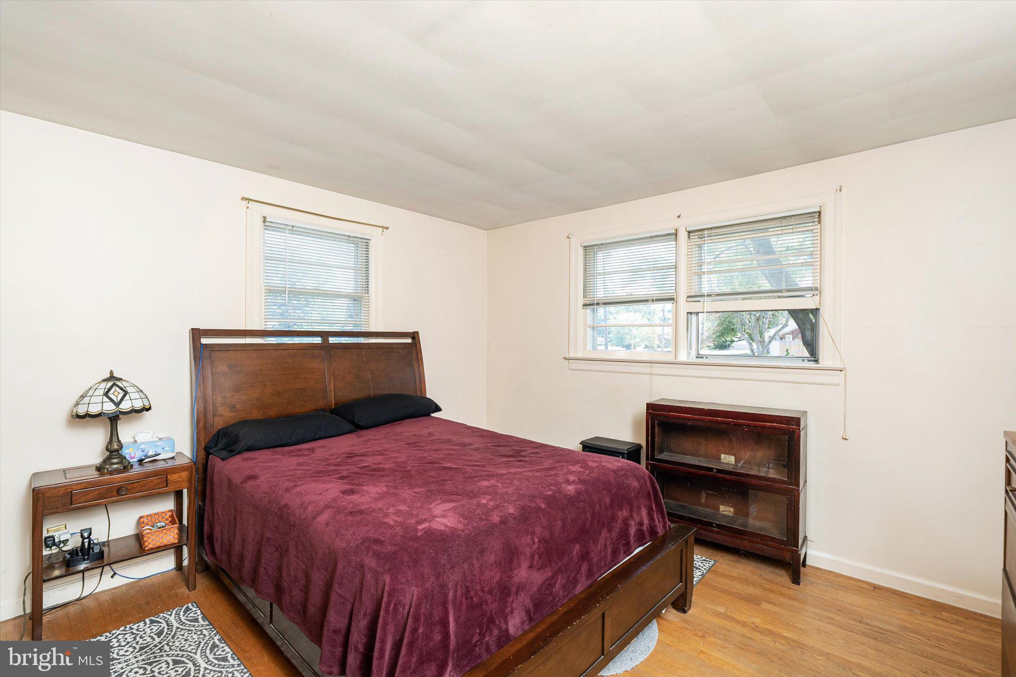 12 Fox Lane Hamilton, NJ 08620 - Photo 20 of 26 a bedroom with a bed and wooden floor
