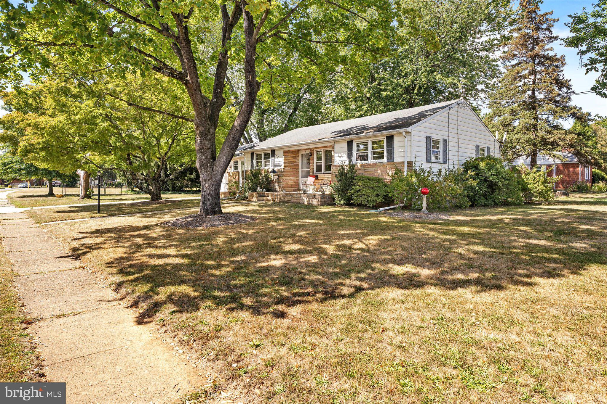 12 Fox Lane Hamilton, NJ 08620 - Photo 3 of 26 a front view of a house with a yard