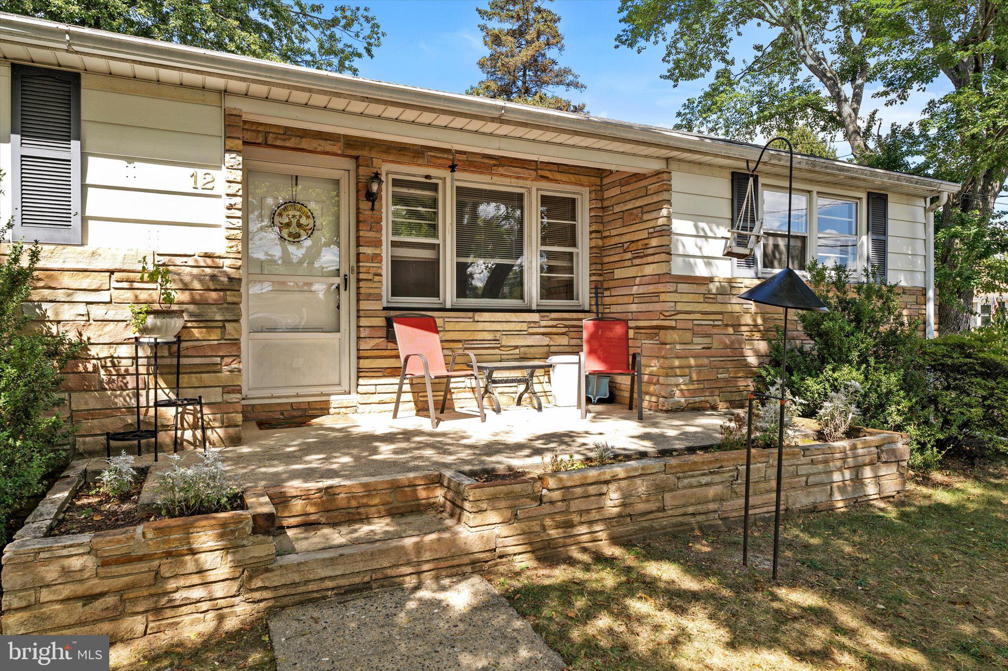 12 Fox Lane Hamilton, NJ 08620 - Photo 4 of 26 a front view of a house with a yard