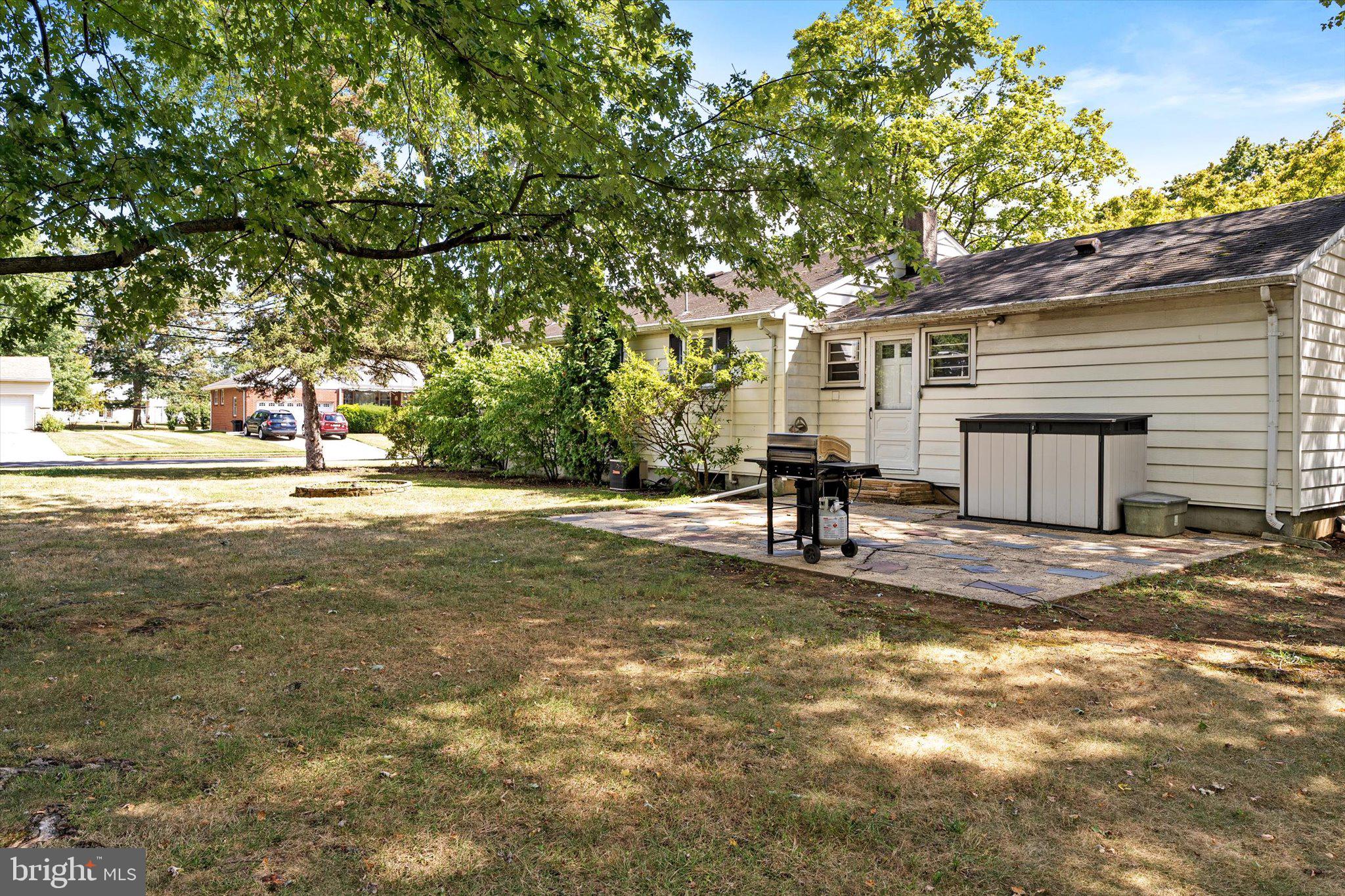 12 Fox Lane Hamilton, NJ 08620 - Photo 7 of 26 a view of a yard with a house and large tree
