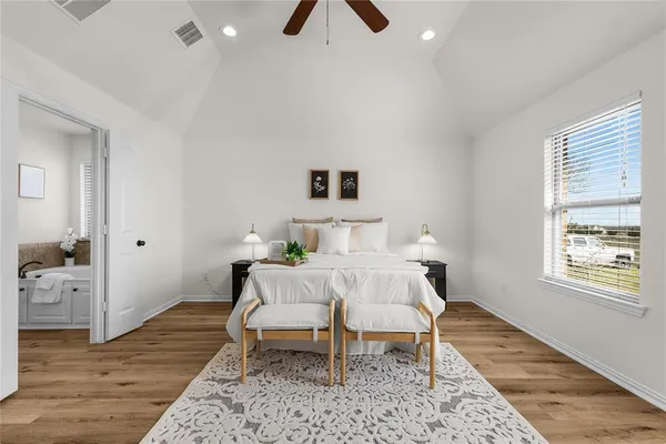 a bed room with a bed and a window