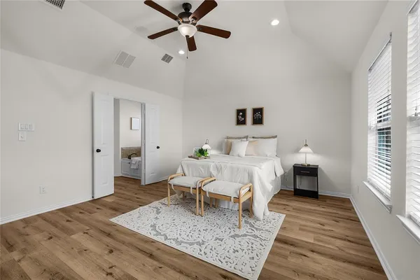 a bed room with a bed and a chandelier