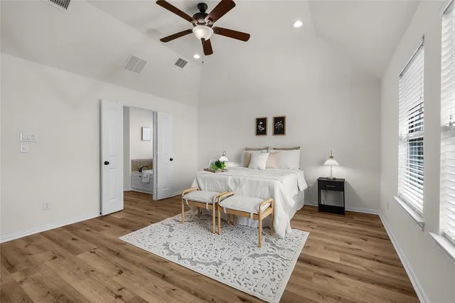 a bed room with a bed and a chandelier