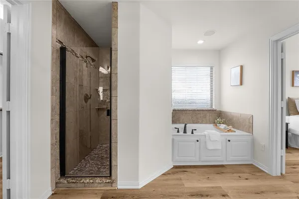 a bathroom with a sink a mirror and a bathtub
