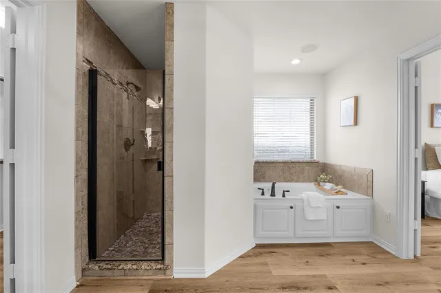 a bathroom with a sink a mirror and a bathtub