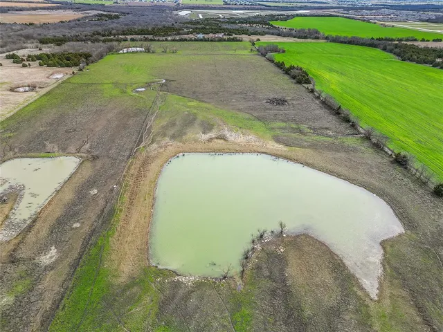a view of a swimming pool with a yard
