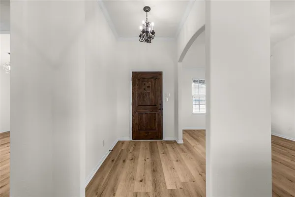 a view of empty room with windows