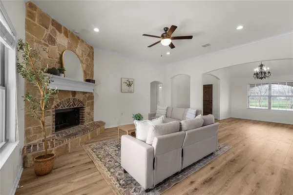 a living room with furniture and a fireplace