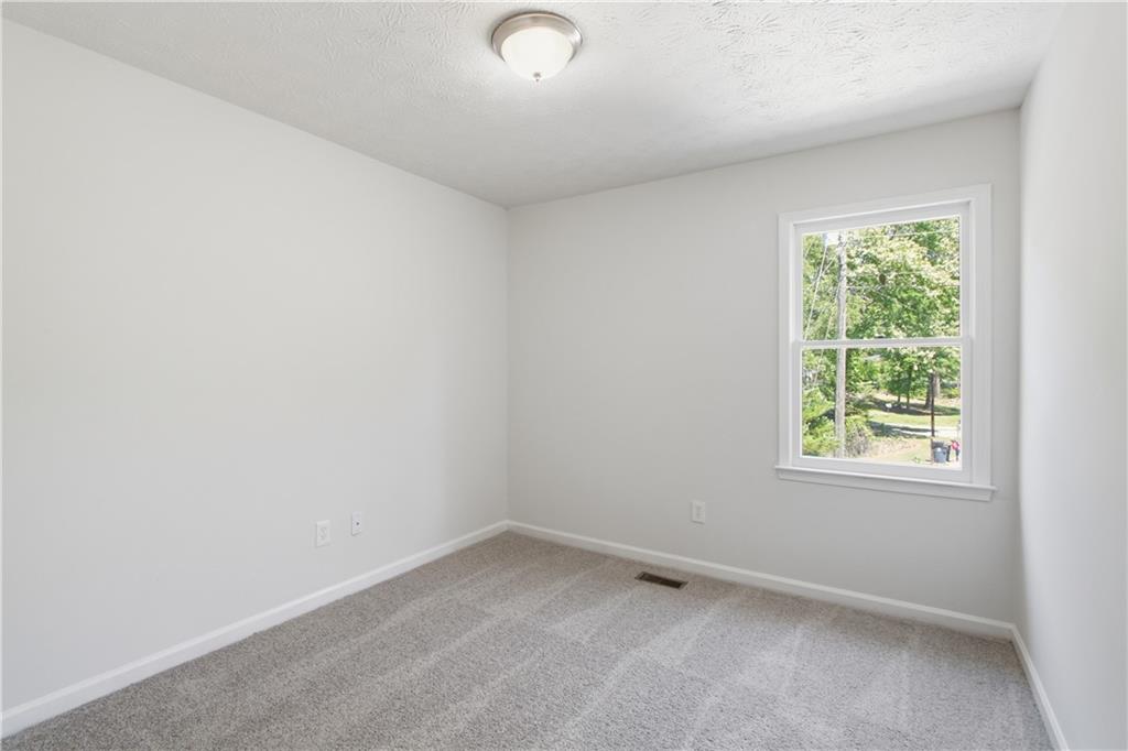 79 Cross Creek Court Villa Rica, GA 30180 - Photo 15 of 27 an empty room with a window