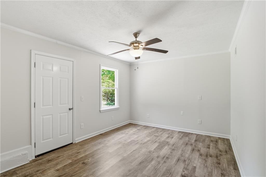 79 Cross Creek Court Villa Rica, GA 30180 - Photo 17 of 27 wooden floor in an empty room with a window