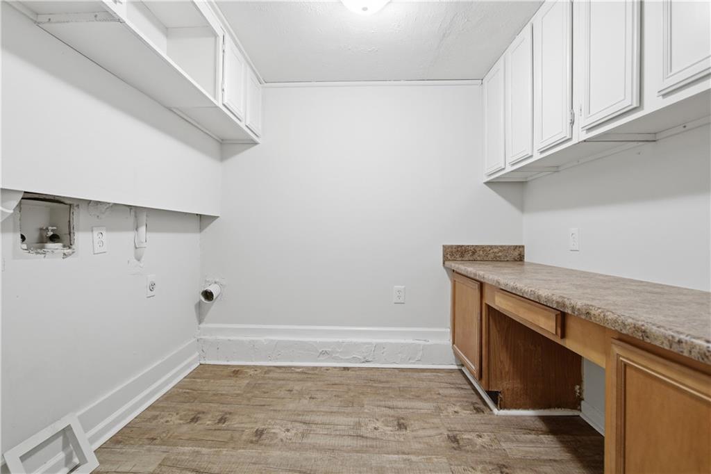79 Cross Creek Court Villa Rica, GA 30180 - Photo 19 of 27 a view of storage and utility room with wooden floor