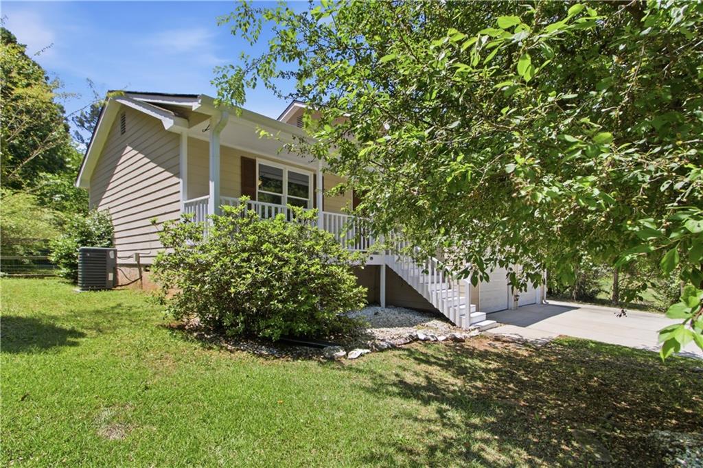 79 Cross Creek Court Villa Rica, GA 30180 - Photo 21 of 27 a front view of a house with a yard