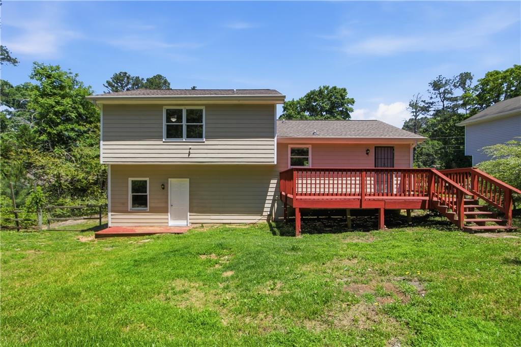 79 Cross Creek Court Villa Rica, GA 30180 - Photo 22 of 27 a front view of a house with a yard