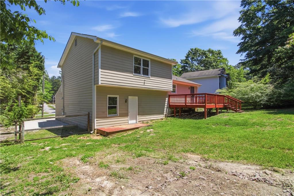 79 Cross Creek Court Villa Rica, GA 30180 - Photo 25 of 27 a front view of a house with a yard and trees