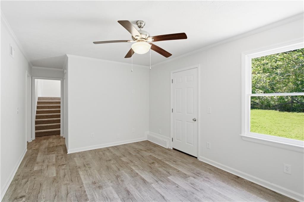 79 Cross Creek Court Villa Rica, GA 30180 - Photo 4 of 27 a view of empty room with wooden floor and fan
