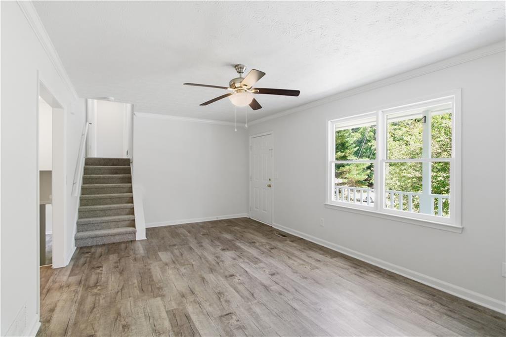 79 Cross Creek Court Villa Rica, GA 30180 - Photo 5 of 27 wooden floor in an empty room with a window