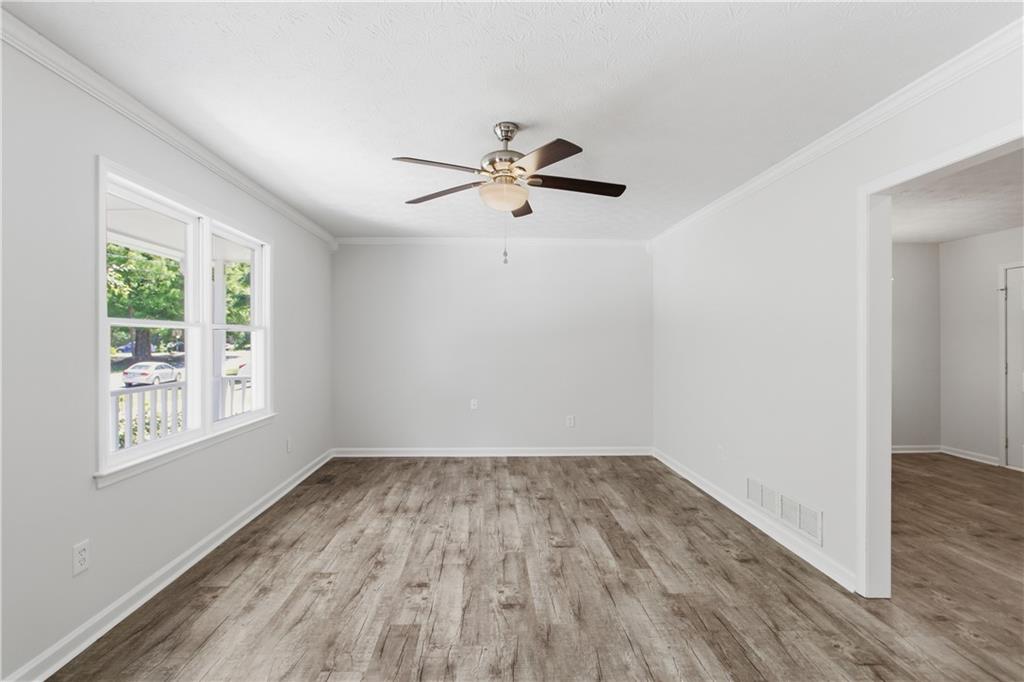 79 Cross Creek Court Villa Rica, GA 30180 - Photo 7 of 27 wooden floor in an empty room with a window