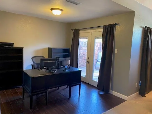 a workspace with furniture and wooden floor