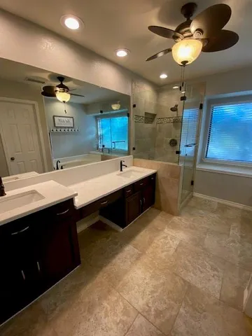 a bathroom with a sink double vanity and a mirror