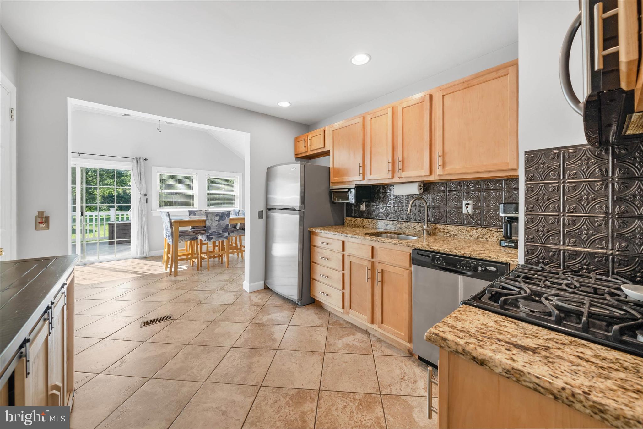 4 Flora Circle Newark, DE 19711 - Photo 14 of 41 a kitchen with stainless steel appliances granite countertop a stove a sink and a microwave