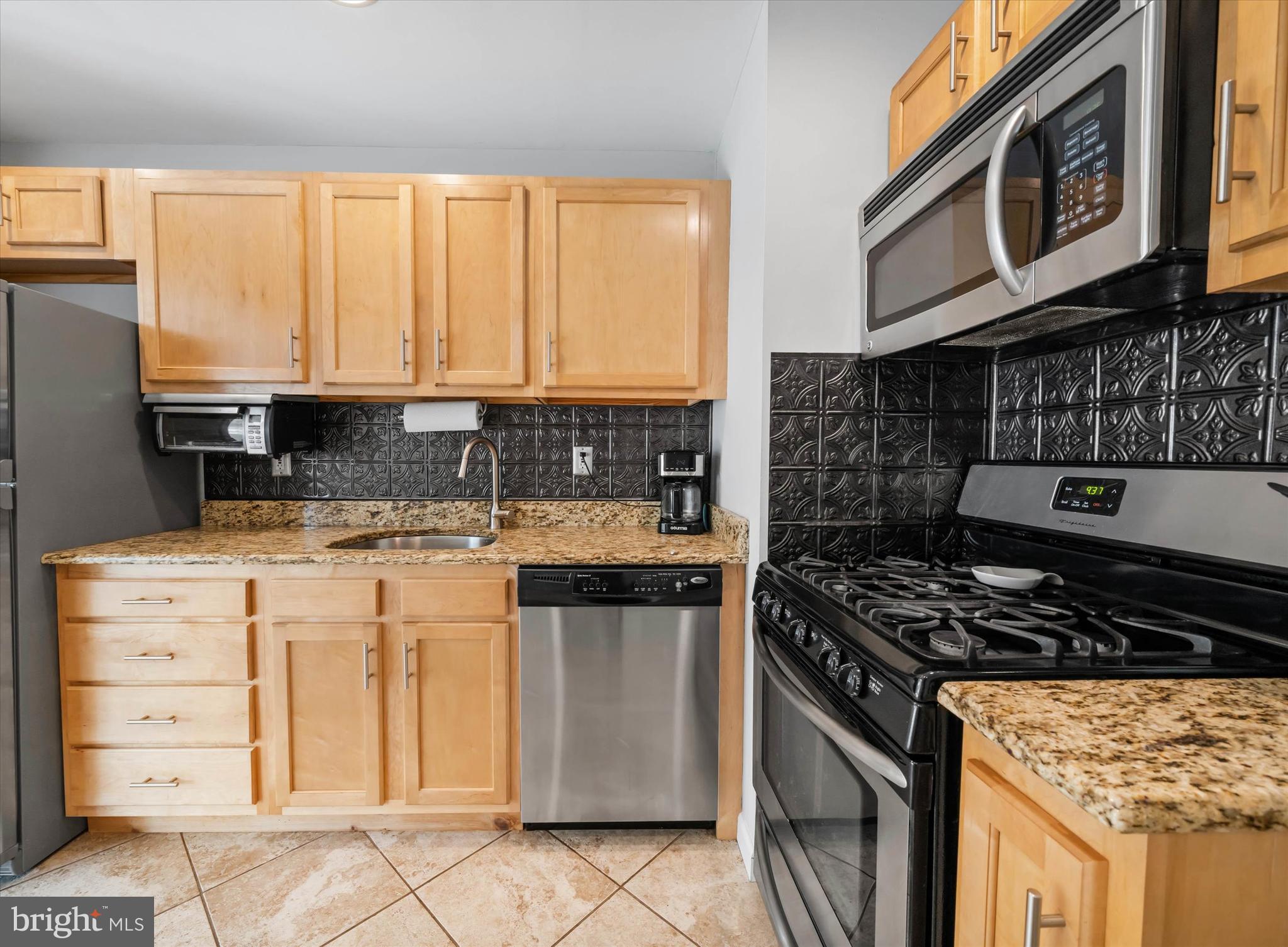 4 Flora Circle Newark, DE 19711 - Photo 15 of 41 a kitchen with stainless steel appliances granite countertop a stove and a sink
