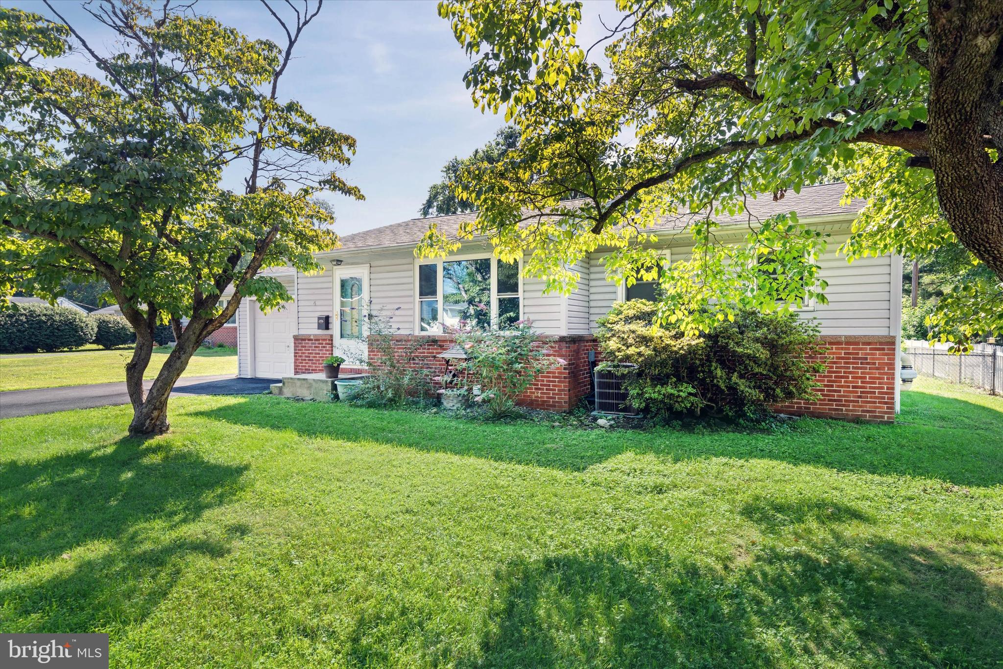 4 Flora Circle Newark, DE 19711 - Photo 2 of 41 a view of a house with garden and a tree
