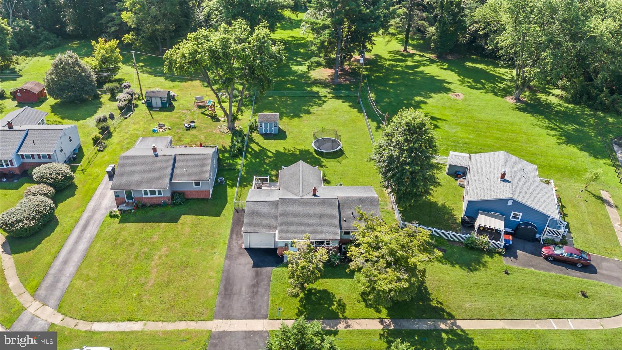 4 Flora Circle Newark, DE 19711 - Photo 7 of 41 an aerial view of a house with a garden and swimming pool