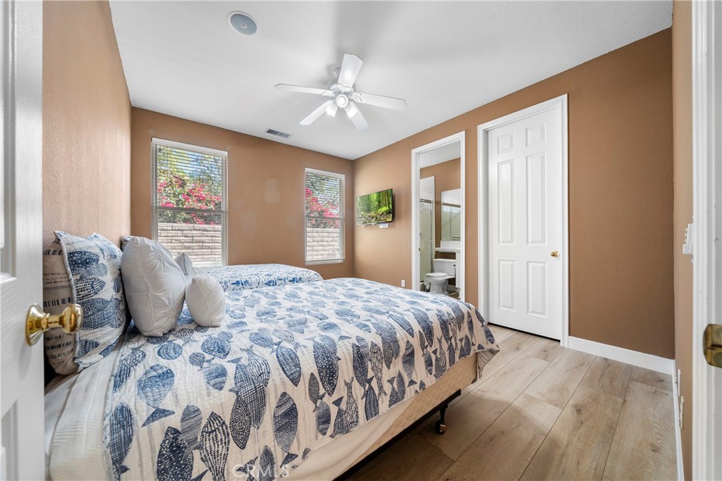 17 Oakmont Drive Rancho Mirage, CA 92270 - Photo 14 of 27 a bedroom with a large bed and a window