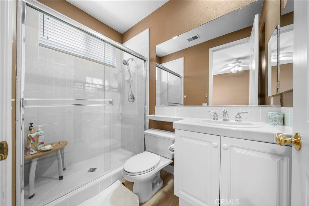 17 Oakmont Drive Rancho Mirage, CA 92270 - Photo 15 of 27 a bathroom with a toilet sink vanity granite and shower