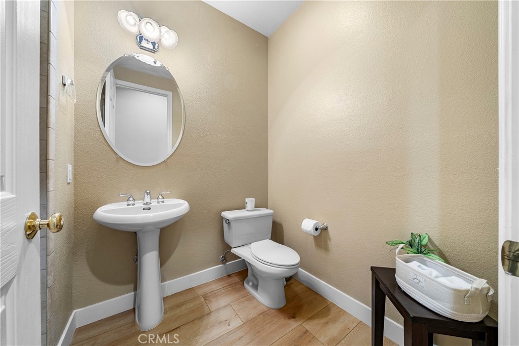 17 Oakmont Drive Rancho Mirage, CA 92270 - Photo 20 of 27 a bathroom with a sink a toilet and a mirror