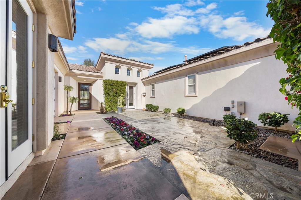 17 Oakmont Drive Rancho Mirage, CA 92270 - Photo 25 of 27 a view of a house with backyard and garden