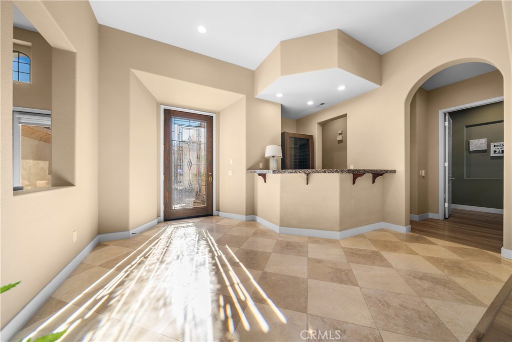 17 Oakmont Drive Rancho Mirage, CA 92270 - Photo 3 of 27 a view of a big room with wooden floor and windows